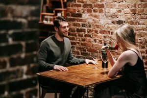 Image of a couple on their first date, questions to ask on your first date.