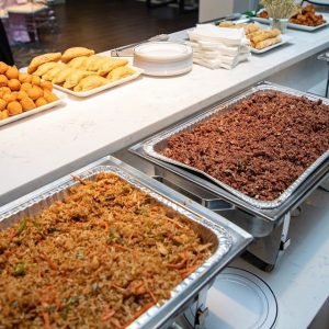 Image of Ghanaian jollof and waakye from Freda's catering, wedding vendor types. weddords.com.